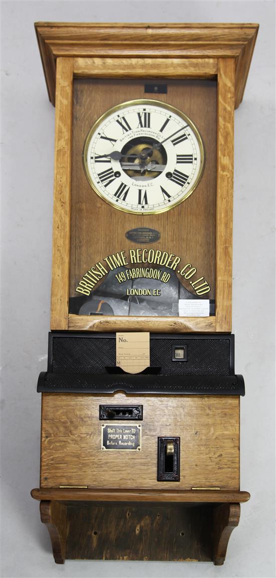 An early 20th century oak British Time Recorder Co. Ltd clocking-in wall clock, H. 3ft 9in(-)